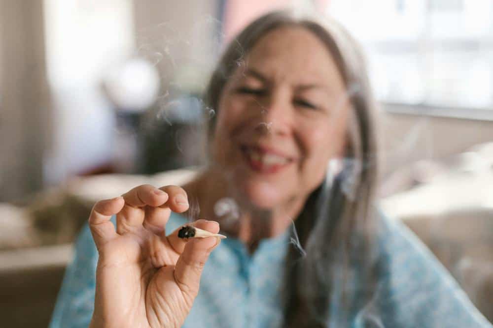 elderly woman smoking joint