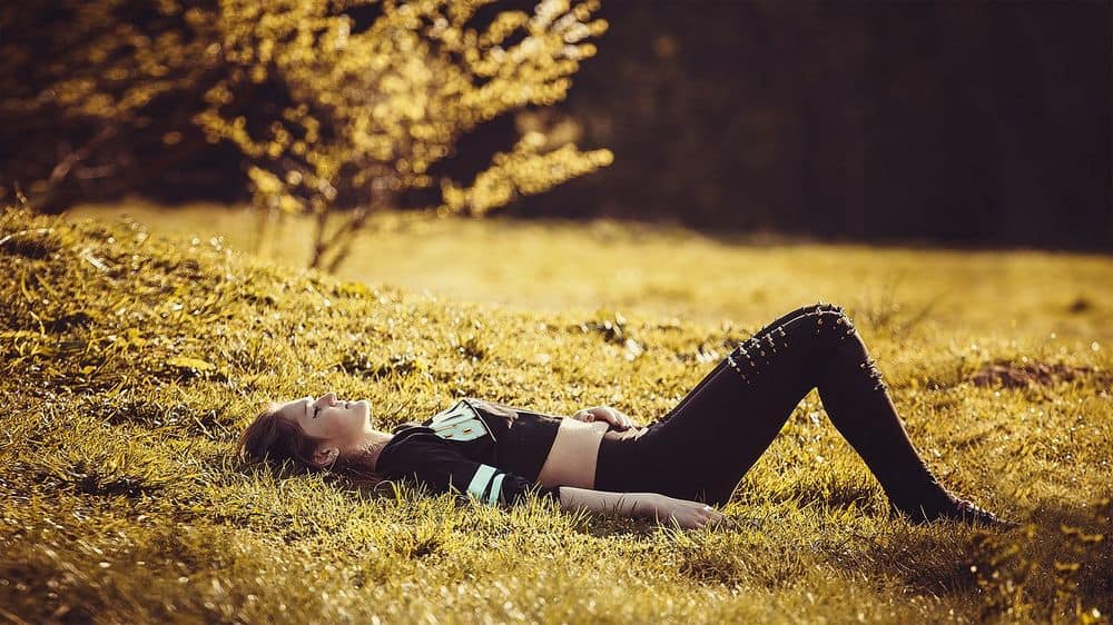 woman in good mood on grass